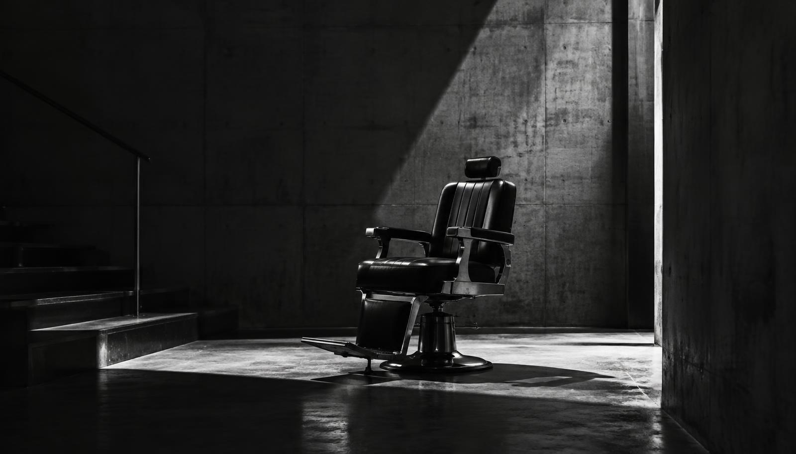 Barber chair in an industrial concrete space